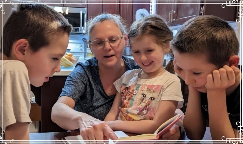 Me reading a rough draft of my book to my three grandchildren.